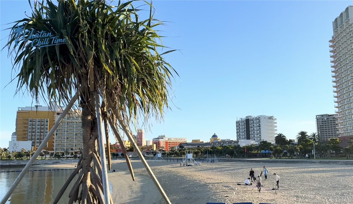 A beach in Chatan with pandanus trees